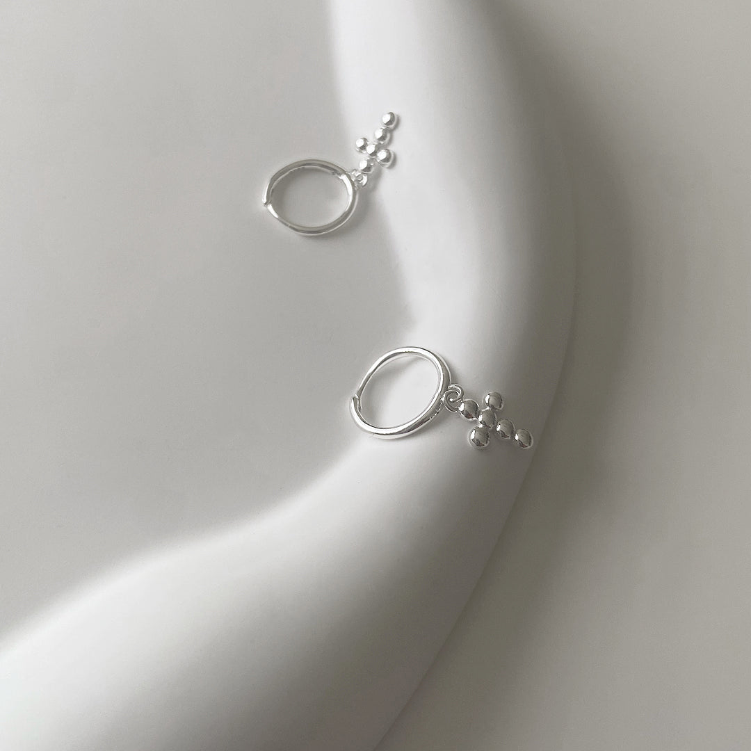 shop our mini bubble cross earrings made of 925 sterling silver
