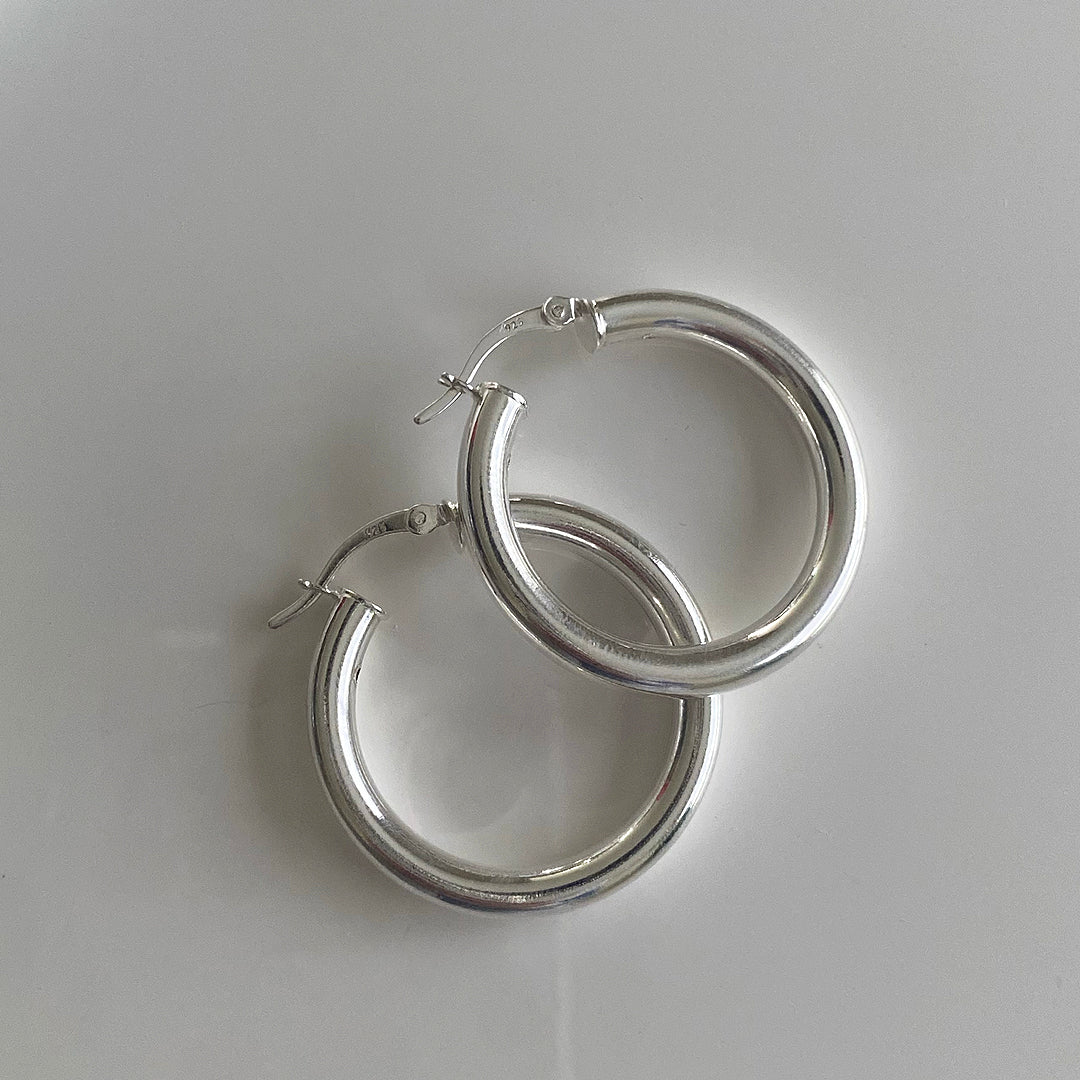 Close up view of CHESI 925 sterling silver Classic Tube Hoops 30mm.