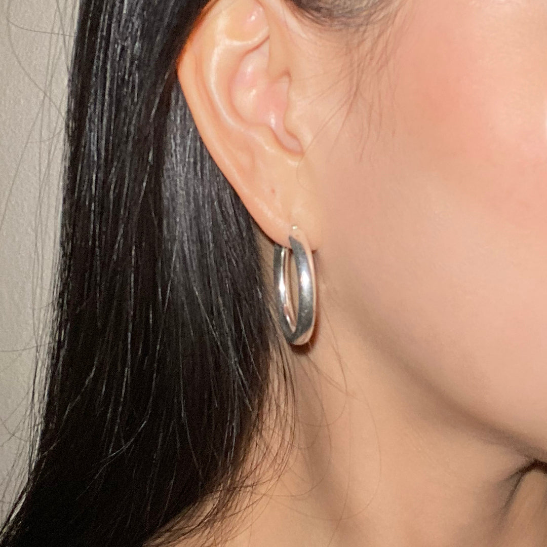 CHESI 925 sterling silver Classic Tube Hoops 30mm worn by model.