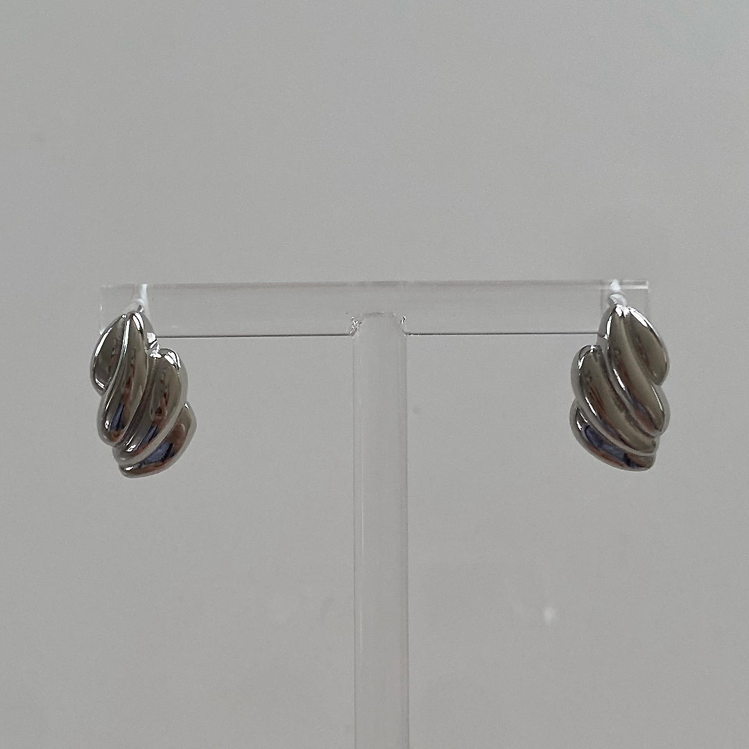 Close-up view of CHESI 925 sterling silver Croissant Studs.