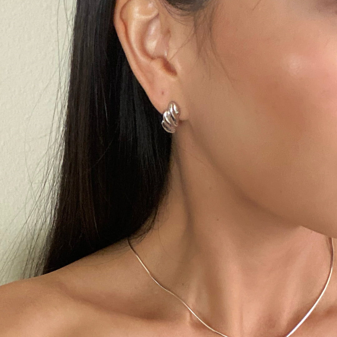 Model wearing CHESI Croissant Stud Earrings in 925 sterling silver.