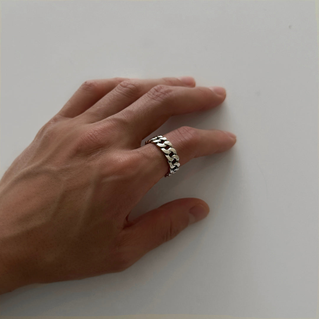 Male model's hand wearing CHESI 925 sterling silver cuban ring