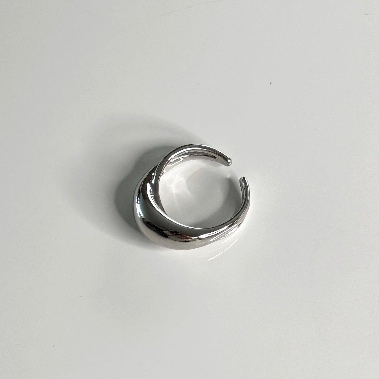 Top angle view of adjustable CHESI 925 sterling silver Dome Cut Out Ring with rhodium plating