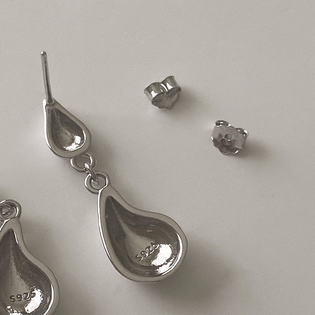 Close-up back view of CHESI 925 sterling silver Droplet Earrings with rhodium plating, showing S925 marking and push-back closure.