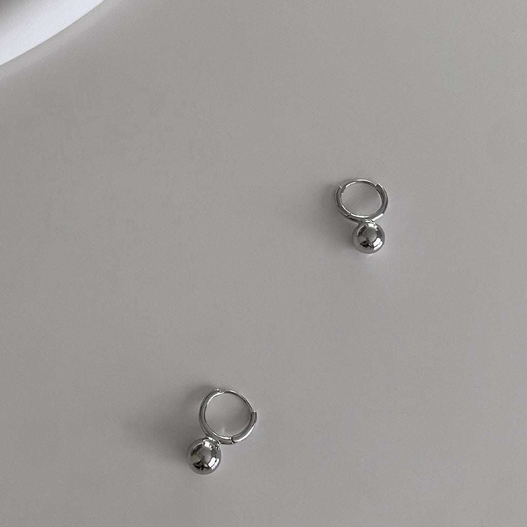 Top view of CHESI 925 sterling silver Mini Ball Huggies 