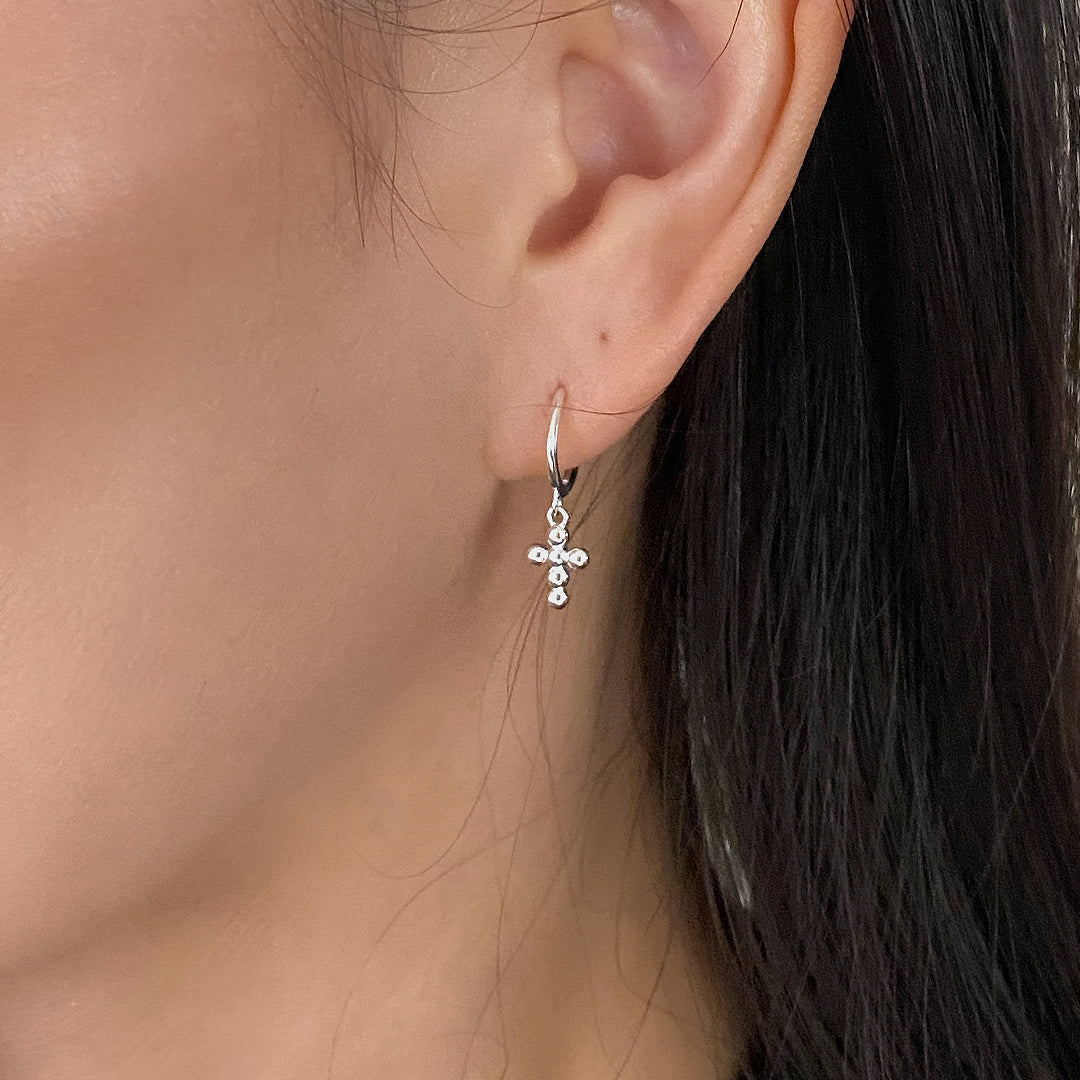CHESI 925 sterling silver Mini Bubble Cross Earrings worn by female model.