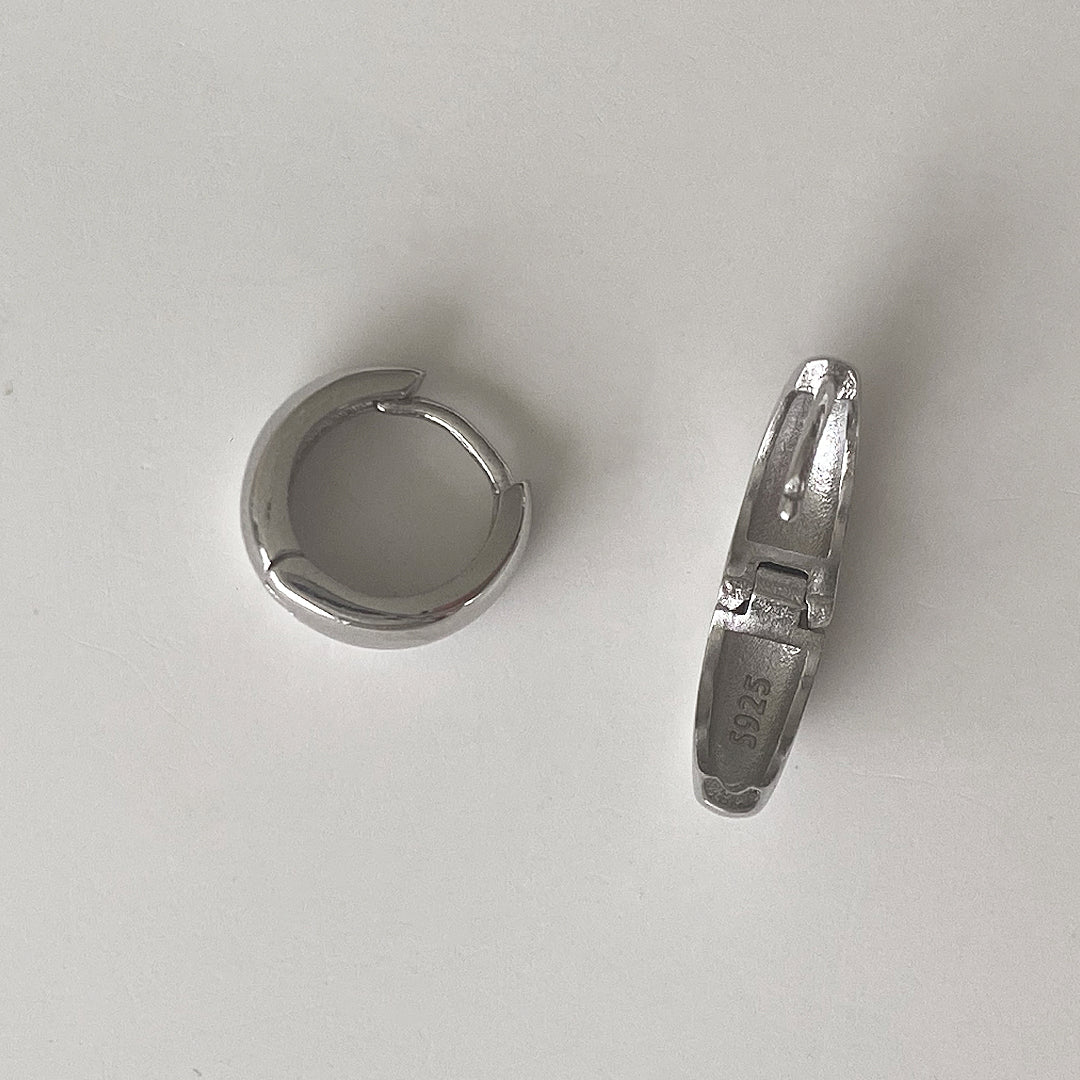 Open close-up detail of CHESI 925 sterling silver Mini Chunky Huggies with rhodium plating showing S925 marking.