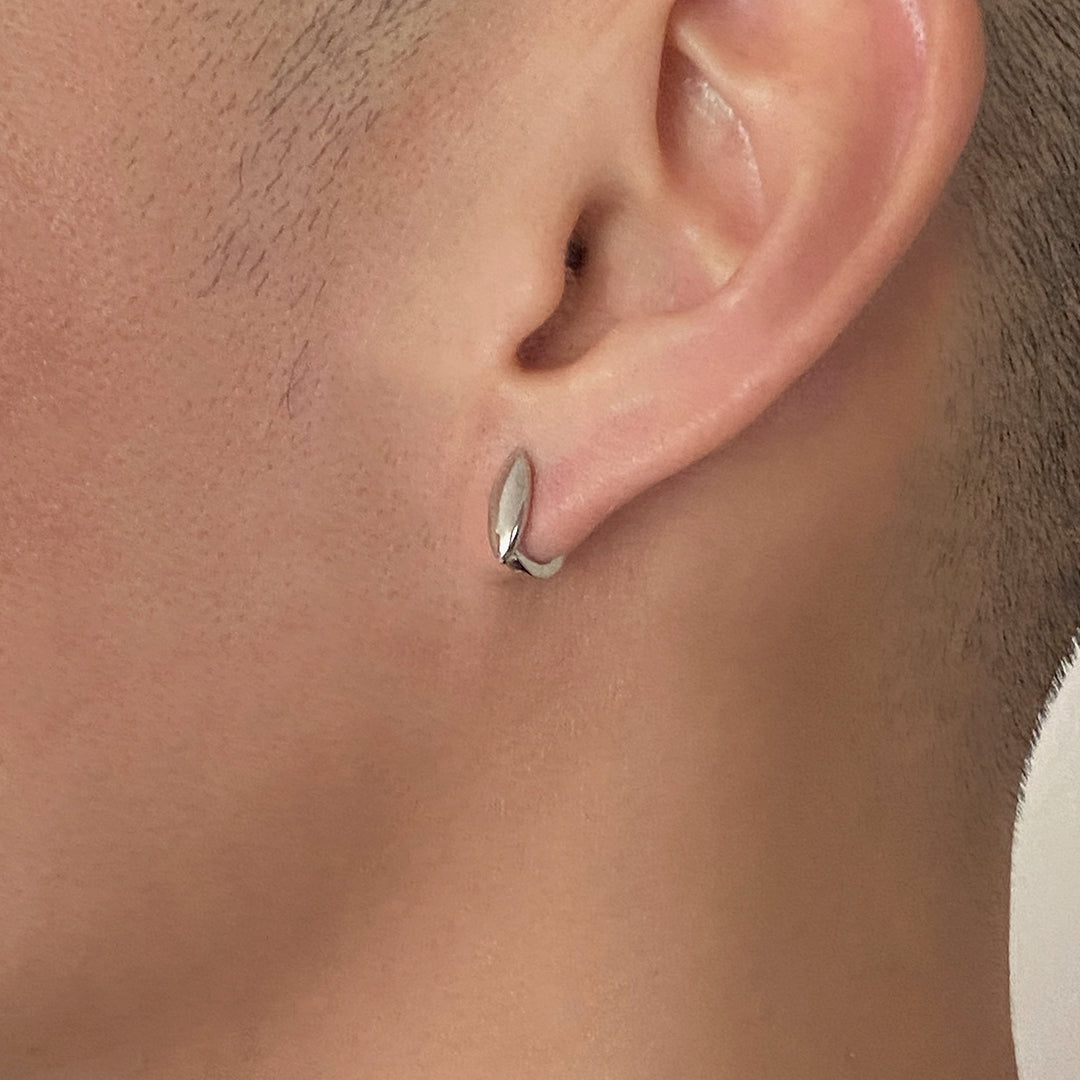 CHESI 925 sterling silver Pointed Mini Huggies with rhodium plating worn by male model.