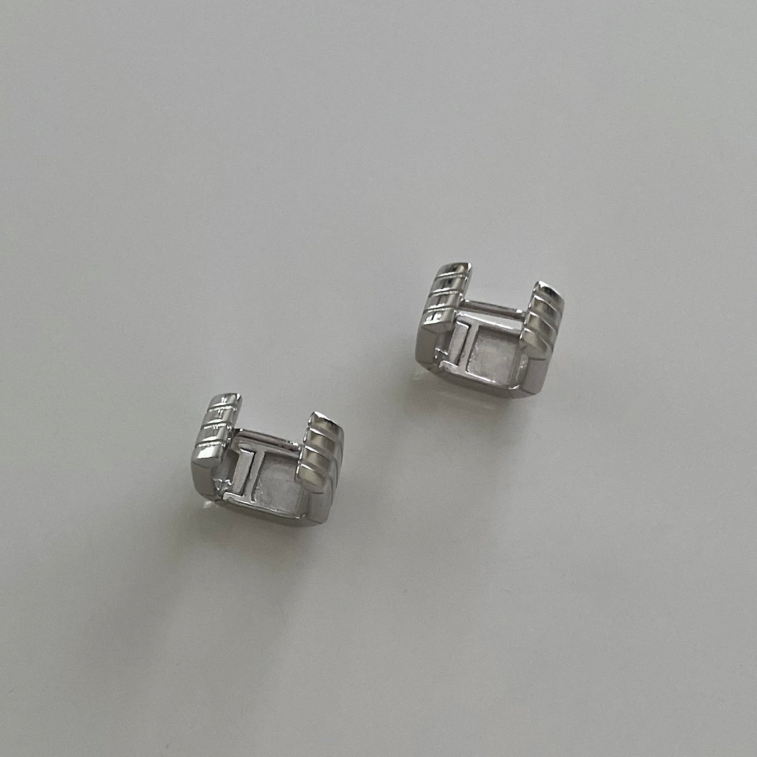 Top hinge view of CHESI 925 sterling silver Square Ridged Huggies.
