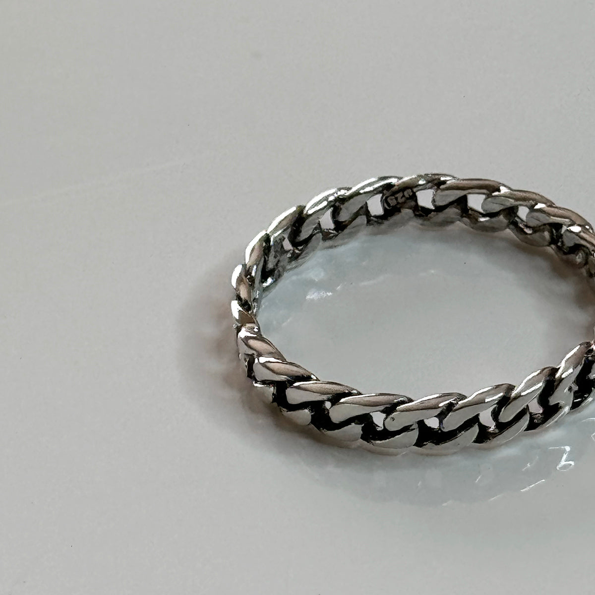 CHESI 925 Sterling Silver Thin Cuban Ring close-up view of details and 925 marking.