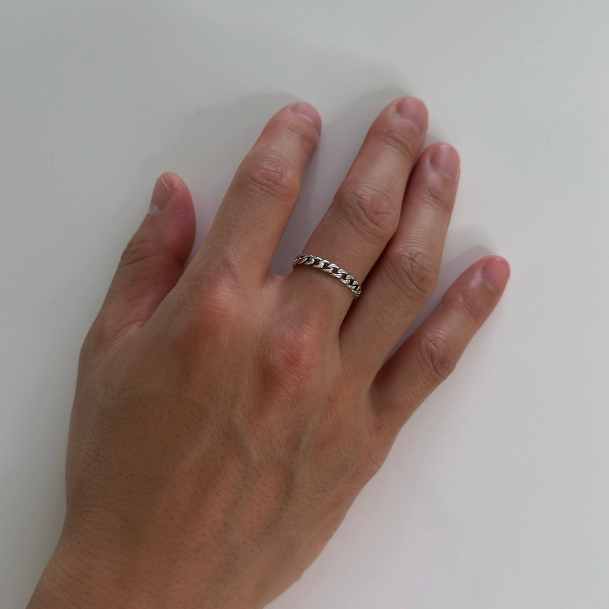 CHESI 925 sterling silver Thin Cuban Ring worn on male model's hand.