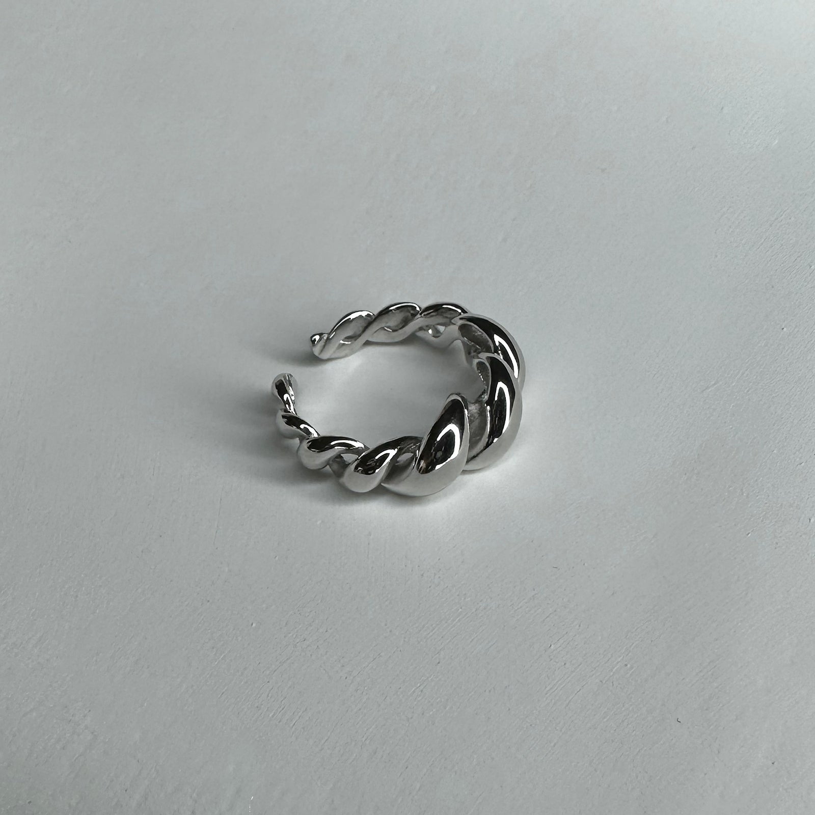 Side view of Twisted Ring. Sterling silver ring that's adjustable