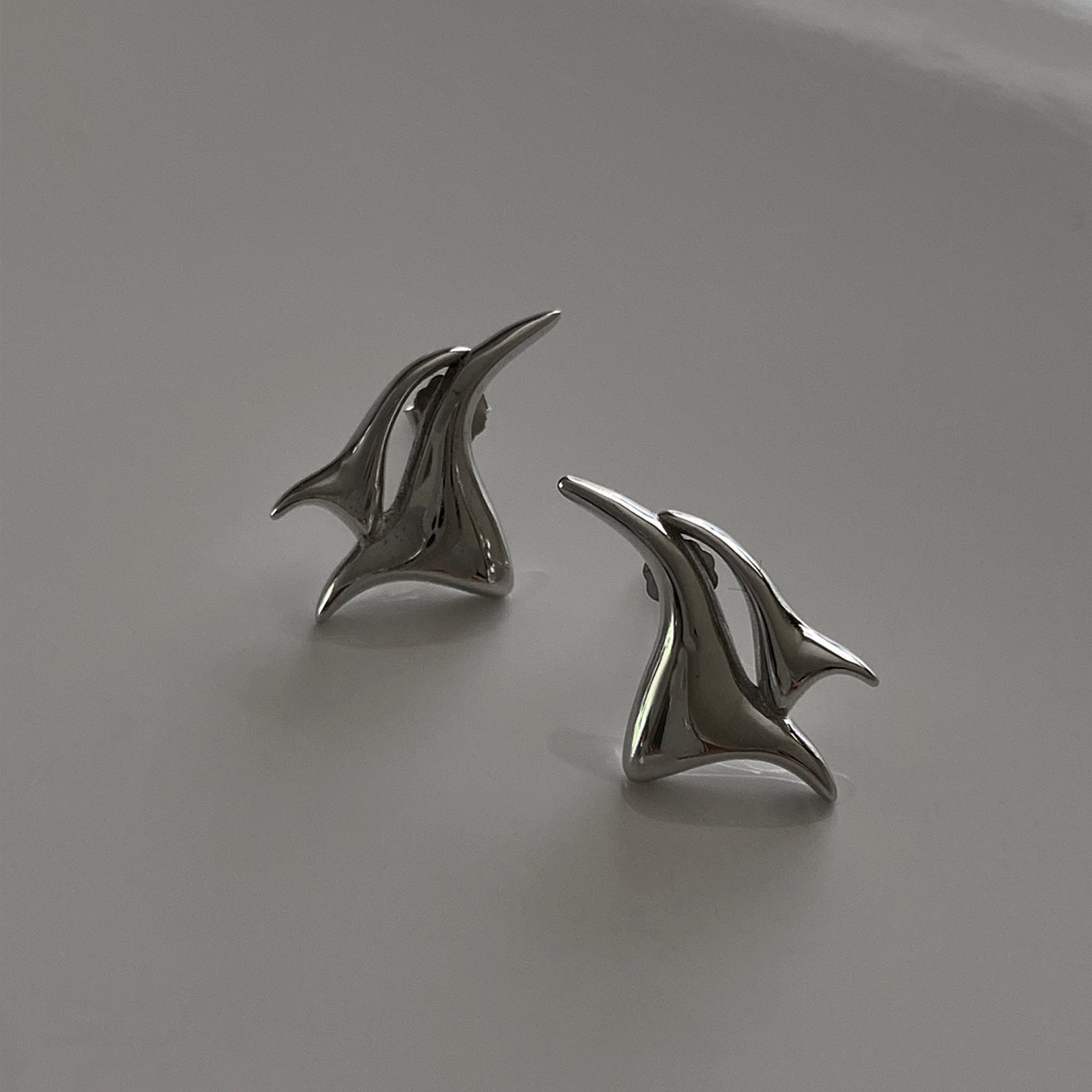 A close up look of our silver studs called Flame Studs.