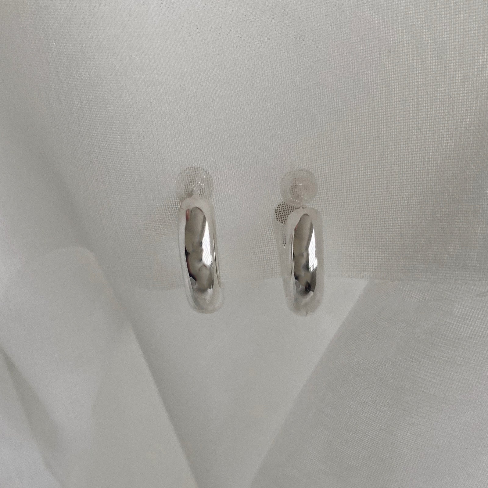 Front view of the Hollow Tube Hoops. These hoop earrings are made of 925 sterling silver with a push back for closure. These earrings are lightweight and hollow.
