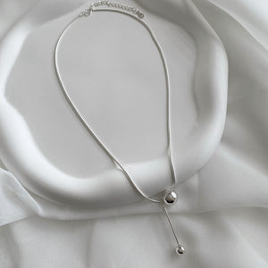 Orbit Charm Necklace is made of 925 sterling silver featuring a round snake chain and sphere drop pendant charm.