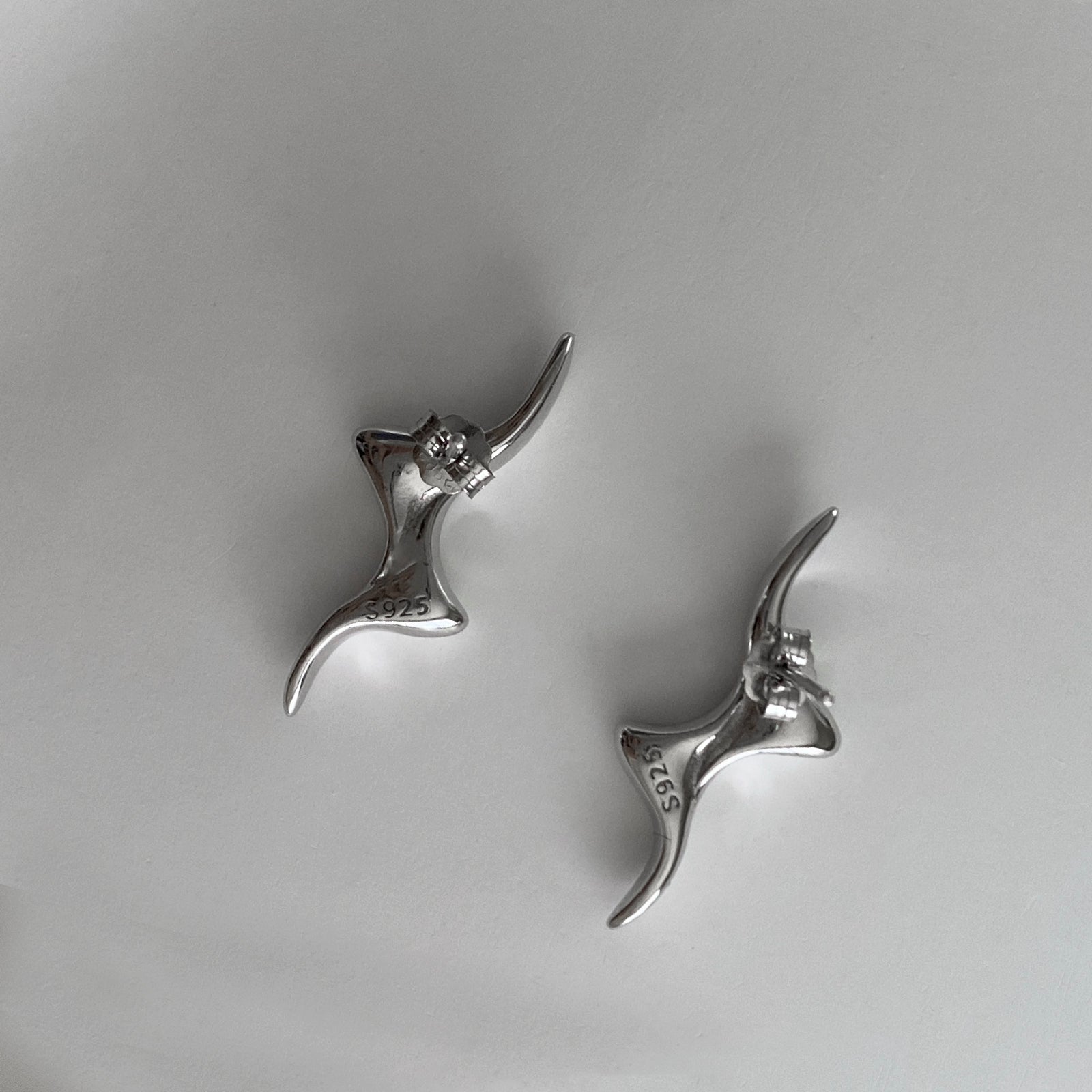 Back view of our Swirly Bolt Studs featuring the push-back closure and our genuine S925 stamp.