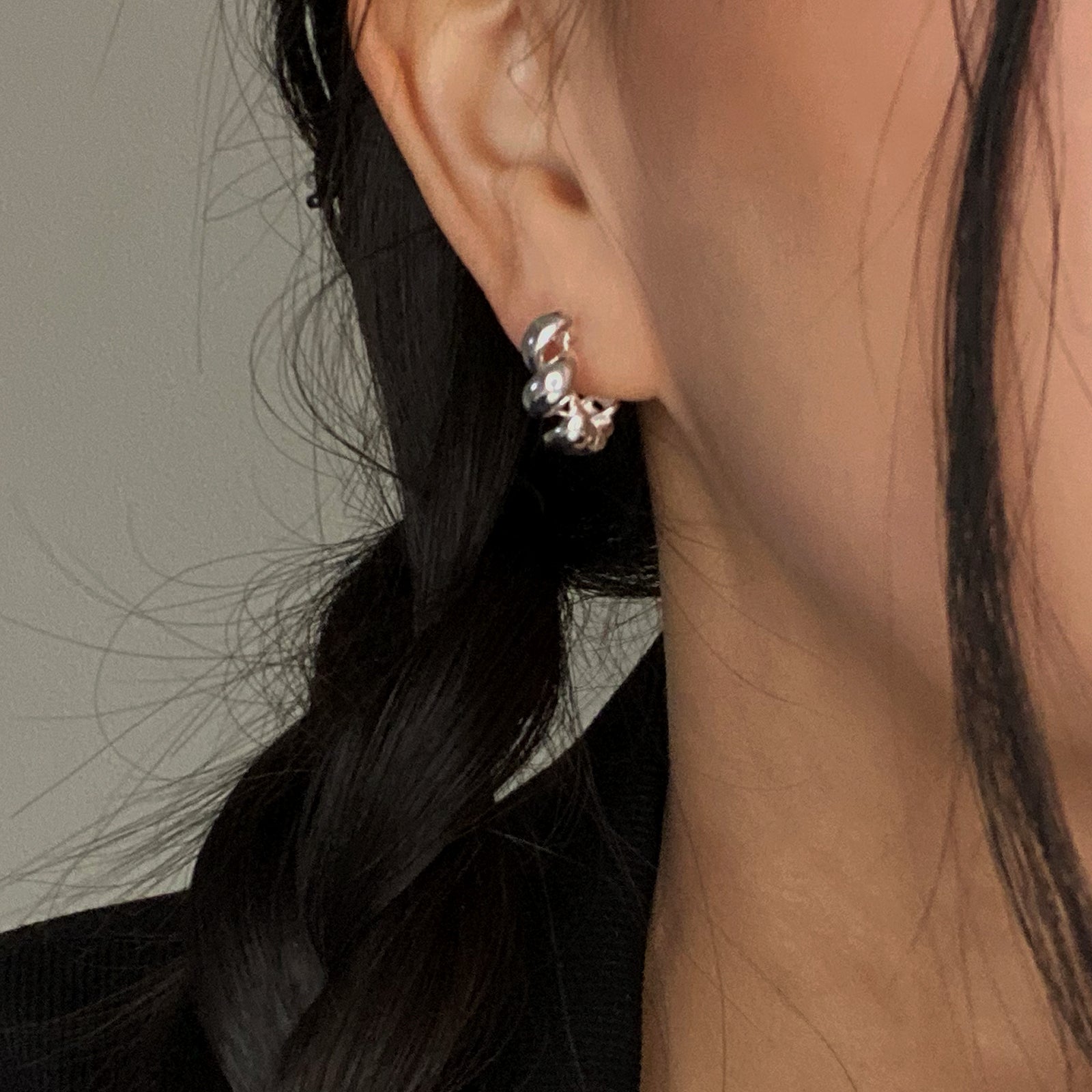 CHESI 925 sterling silver Twisted Hoop Earrings worn by model.